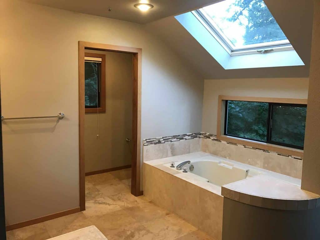 By adding color to the walls and ceilings, the existing tile and floors look nicer and the bathroom has a cozier feel.