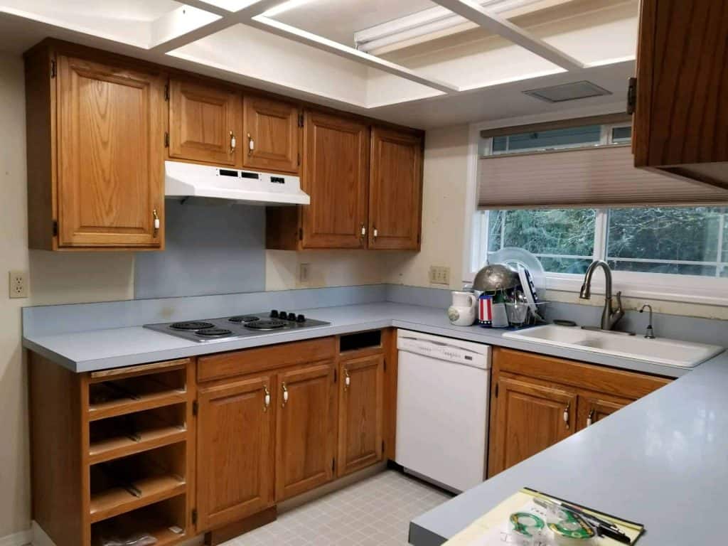You are happy with the general flow and function of the kitchen but want to feel a little more open while maintaining adequate storage space.
