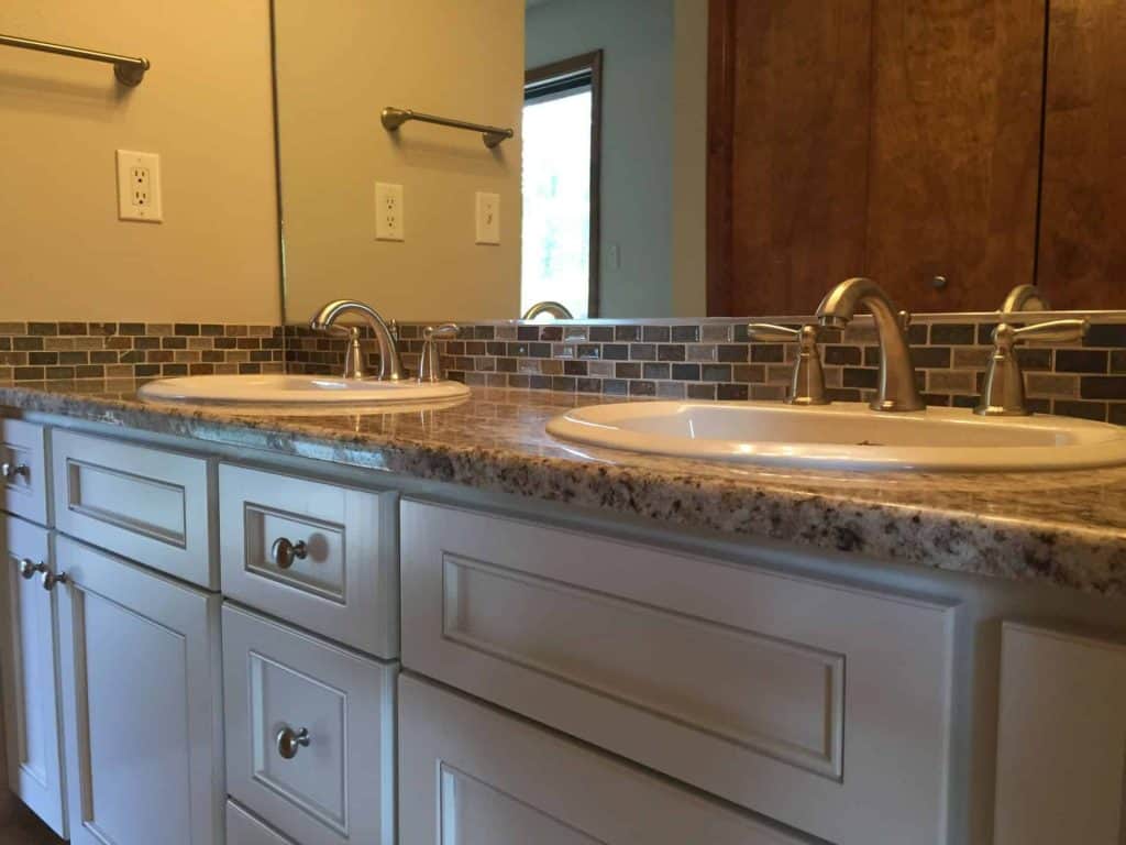 New painted cabinet door and drawer faces, granite countertops, new fixtures, and more!