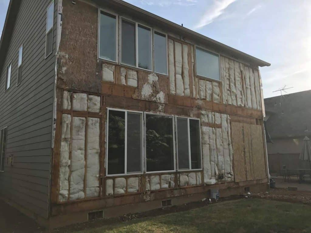 The original siding and windows were not installed properly and there was water penetrating through to the sheathing in multiple areas. As a result, there were dry rot issues that needed to be addressed.