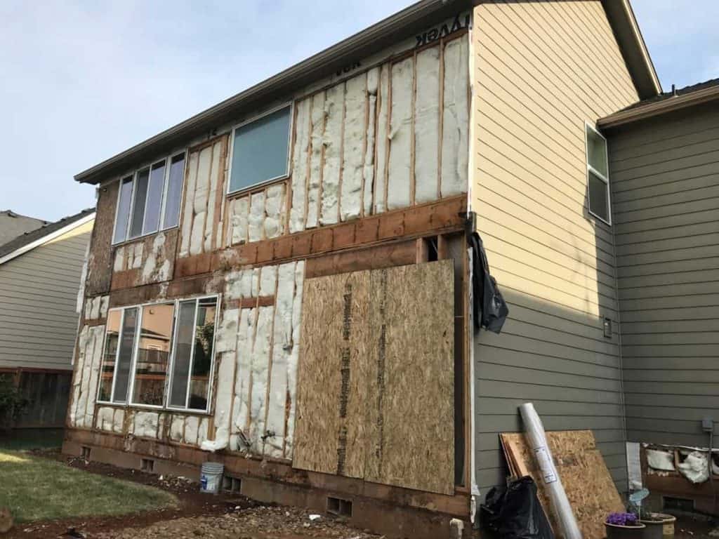 Upon further inspection, it was determined that the windows needed to be pulled and reset correctly, and the home would receive new house wrap and new siding on the sides where the issues were predominant.