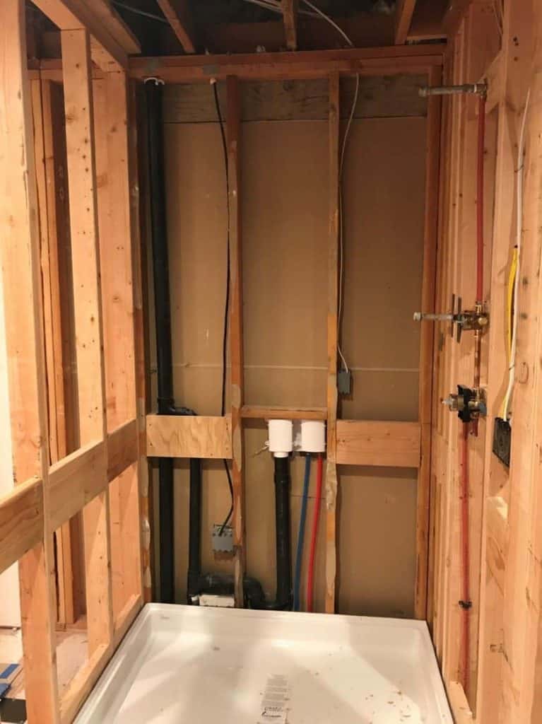 The new -larger- shower space is framed in and the new fiberglass pan is set.