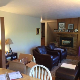 BEFORE Notice the load bearing wall dividing the living room from the kitchen, the old brick fireplace, and the wood paneling….