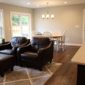 AFTER All of the recessed can lighting really brightens up the space. The “Repose Gray” on the walls provides just enough contrast with The new white trim work. A simple elegant light fixture over the dining table defines that space and its purpose….