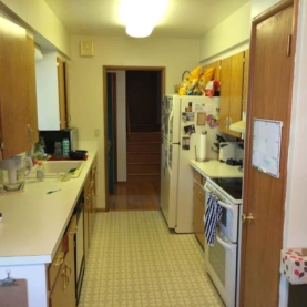 BEFORE An outdated galley kitchen with a customer wish list consisting of an “open” design and a center island