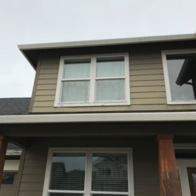 BEFORE The original posts and trim work were faded and there were some water issues that needed to be addressed