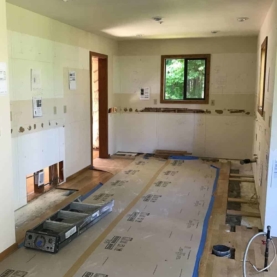 DURING Ram board is down to protect the existing wood floors, everything is removed and we are ready to start the transformation.
