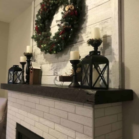 AFTER With a combination of shiplap, brick tile, and a solid wood mantle – their visions would quickly come to life!