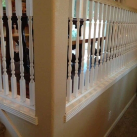 BEFORE The old white spindles and the existing trim profiles were not going to fit with the new design.