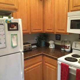 BEFORE The original kitchen had a micro-hood and a lot of inaccessible space in the cabinets. The homeowner requested to have some additional drawer space worked in as well.