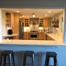 AFTER Light, bright, and now connected to the adjacent room. The bar top is a perfect place for the kids to do their homework while enjoying a snack and spending time with the household chef.