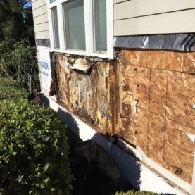DURING Water had been getting behind the flower boxes and leaking into the sheathing. All flower boxes were going to need to be removed and damaged areas addressed.