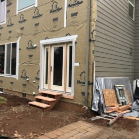 DURING With a trustworthy house wrap system in place, we were getting ready for the new siding to go up.