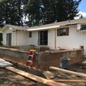 DURING With plenty of space to grow, we decided to add nearly 600 square feet onto the home by making two main additions. We would enlarge the kitchen by stretching into the back yard an additional 18 feet from the original back of the home, and the guest bedroom would call for a separate addition to become a full master suite.