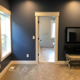 AFTER The trim work consists of finger jointed ½”x 6” base trim, 1x4 door and window casing, and 5/4” headers with 1x2 caps. The variable widths of the trim work create added dimension and a nice sturdy craftsman feel.