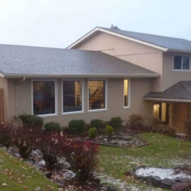 AFTER This is a sneak peak of the home once we were finished. New roof, new siding, new windows, and a whole lot of repair on the interior!
